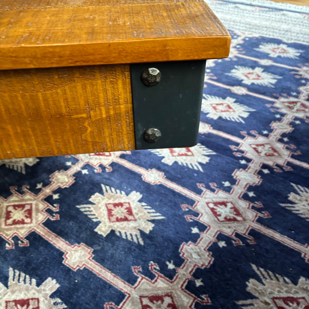 E128 Coffee table with industrial wheels (16” x 47” x 31”) **one wheel is slightly bent