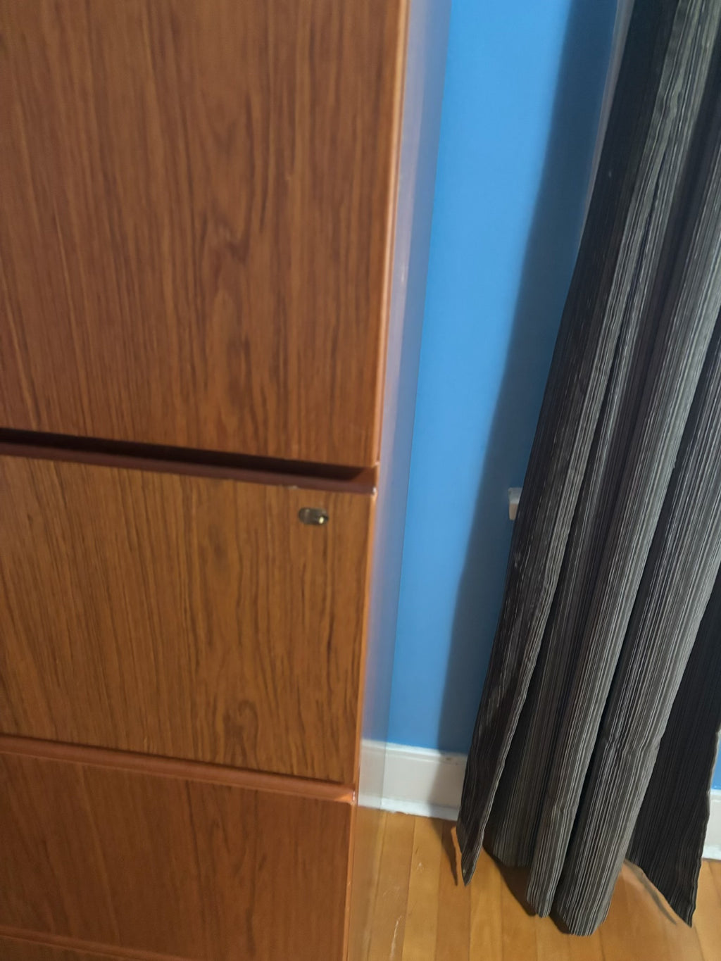 E332 Wood paneled 4 drawer file cabinet (49" x 32" x 20")