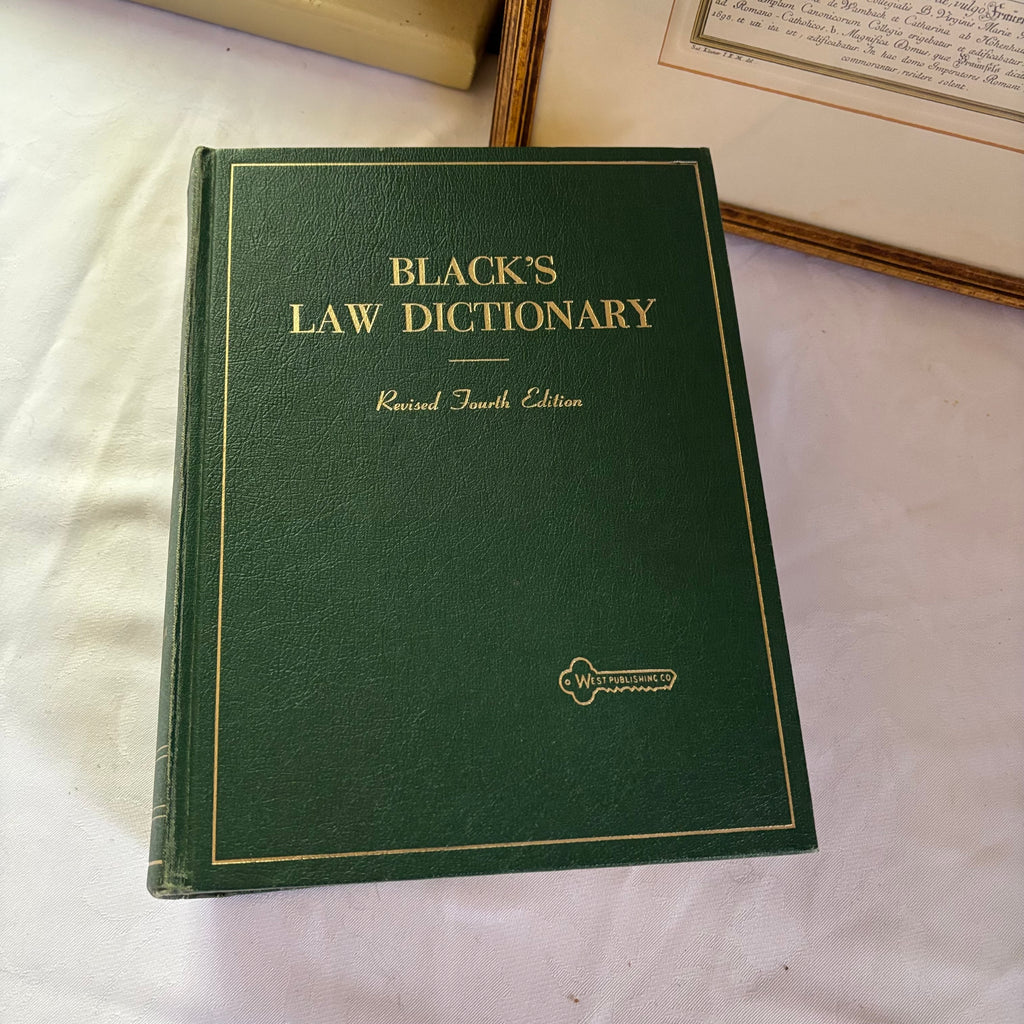 E148 Vintage law dictionary and framed wall art grouping