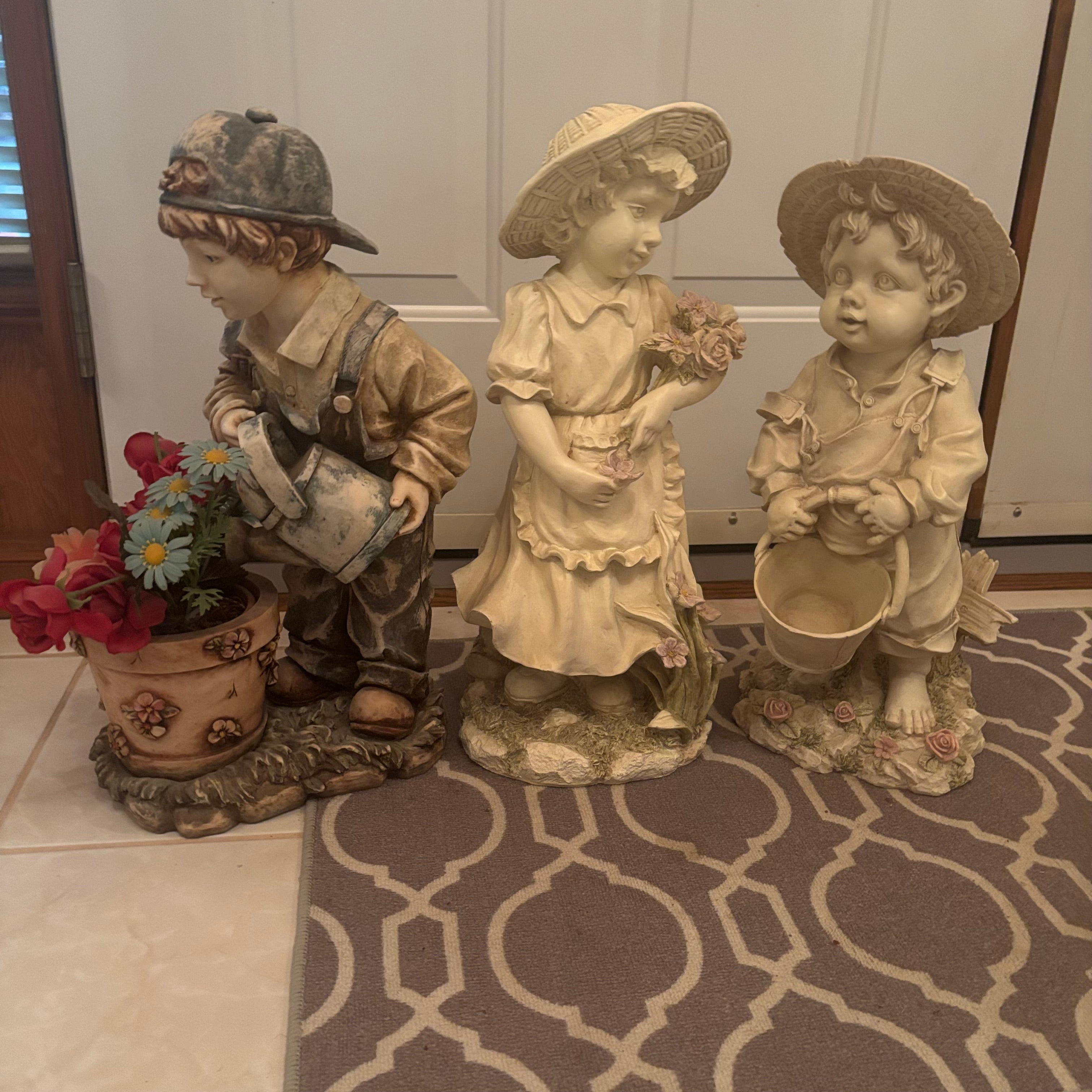 F198 3 22” tall stoneware garden figures