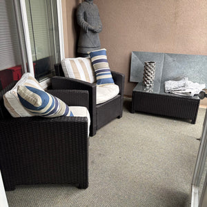 C712 Dark brown wicker patio set (two chairs and coffee table with cushions) (**statue not included**)