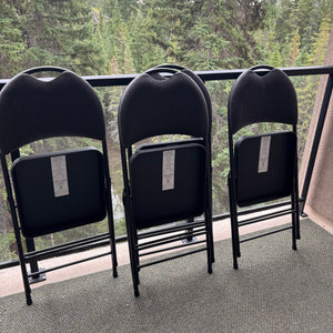 C714 Set of 4 black metal and vinyl folding chairs