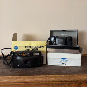 W619 Vintage Minolta Freedom AE35R 35mm camera grouping (new in box but untested)