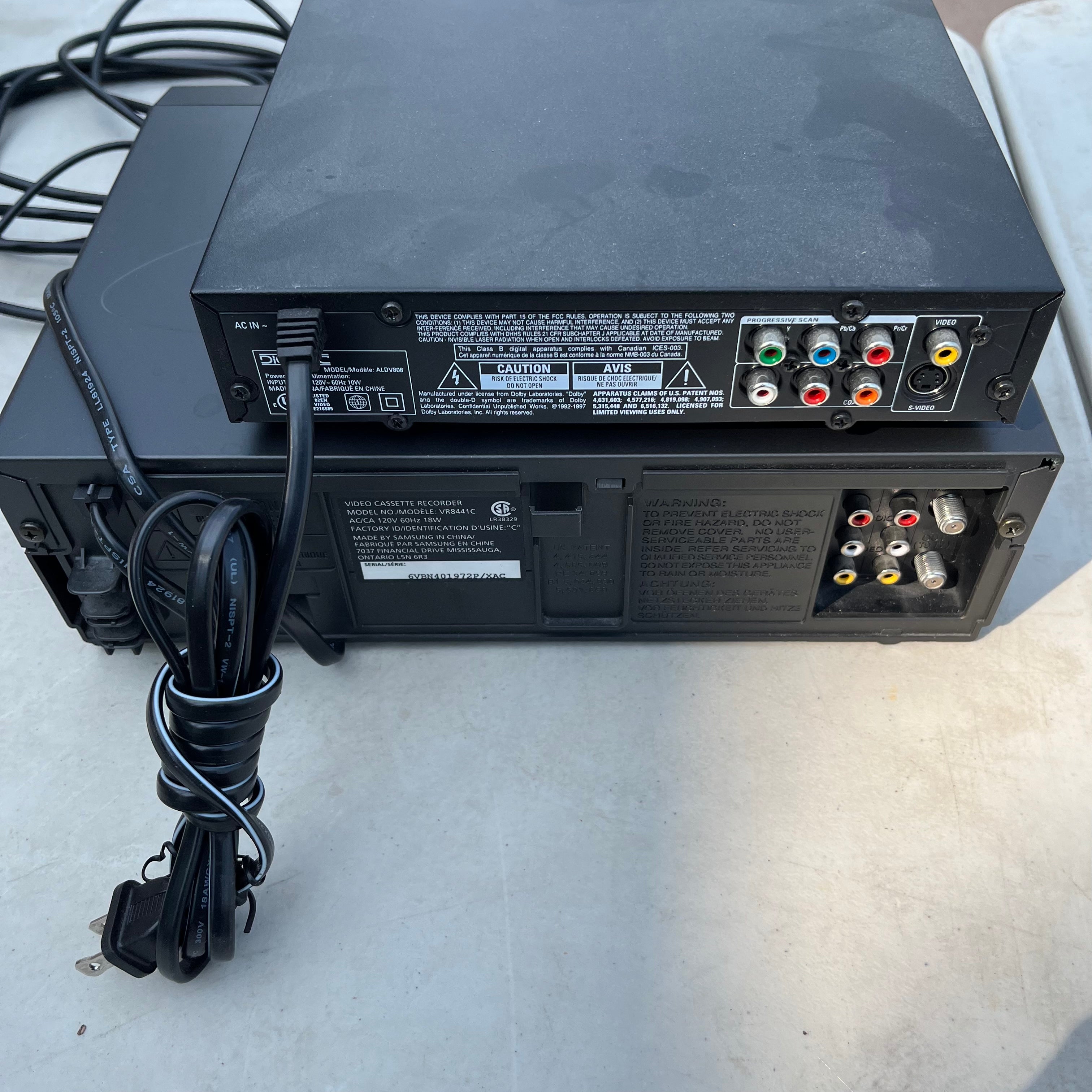 D652 VHS and DVD players (1 has no remote)