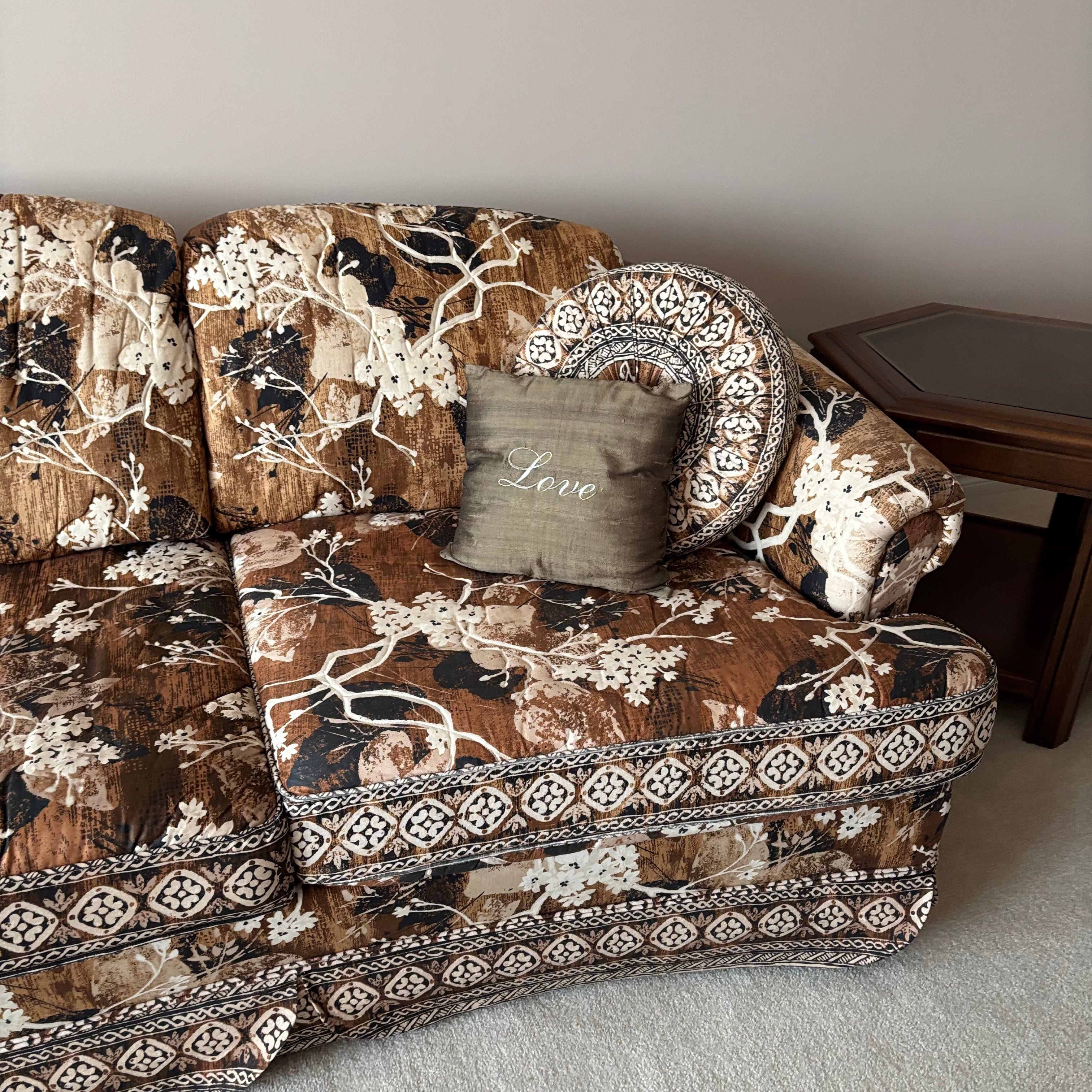 E744 Vintage upholstered brown and beige floral sofa