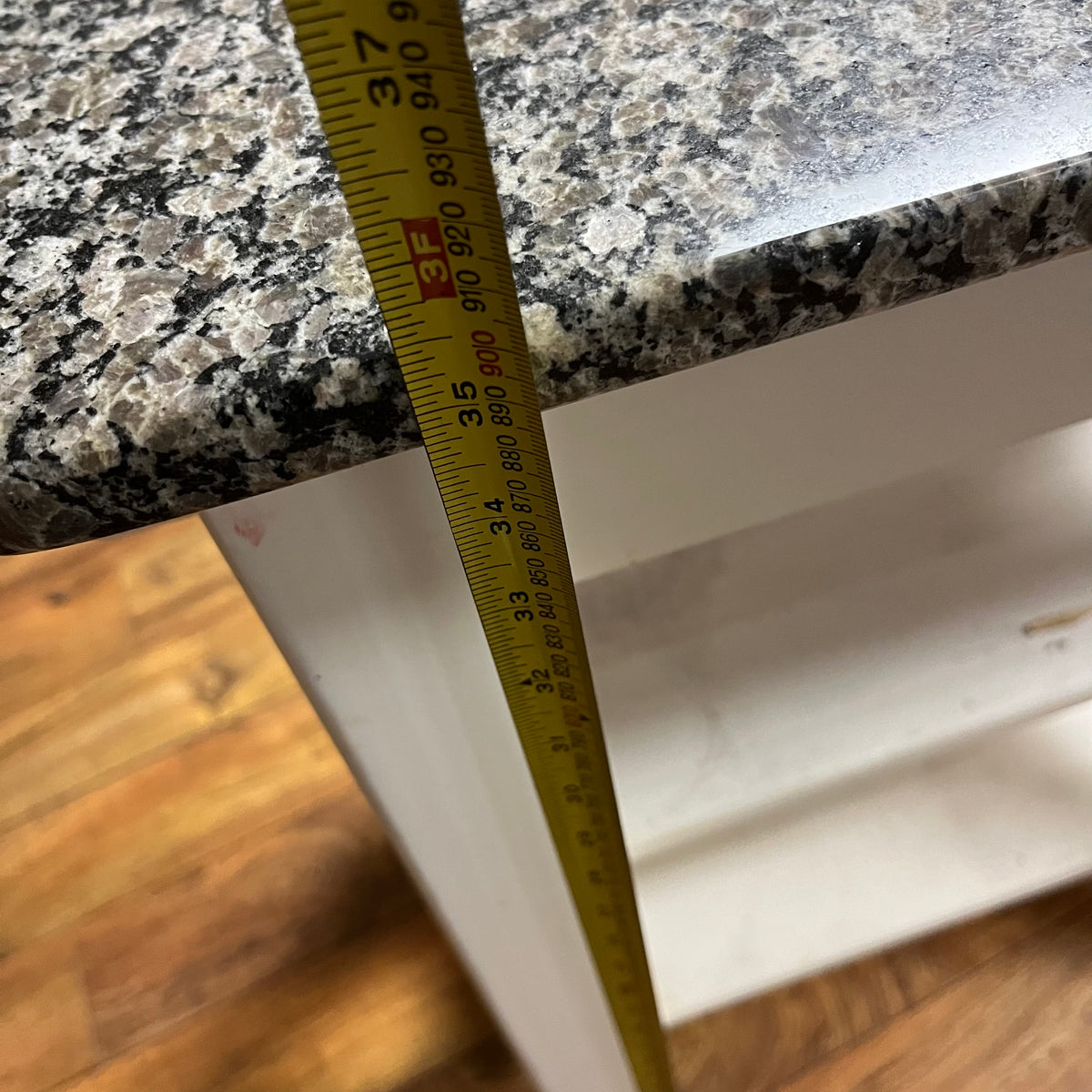 F517 White kitchen island with marble top (26" x 21" x 36")(some paint has chipped)