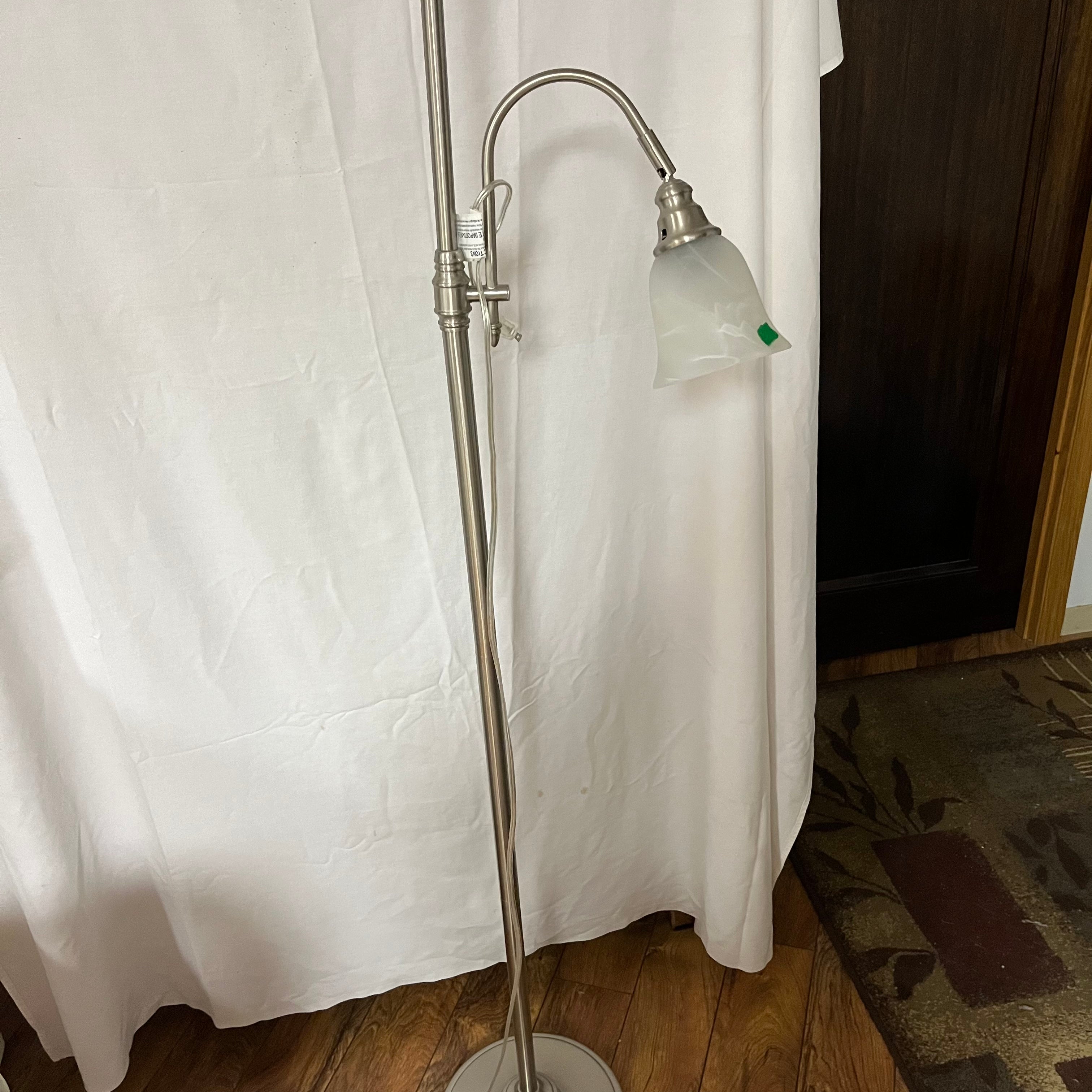F531 Torchiere style lamp with metal base and adjustable reading lamp