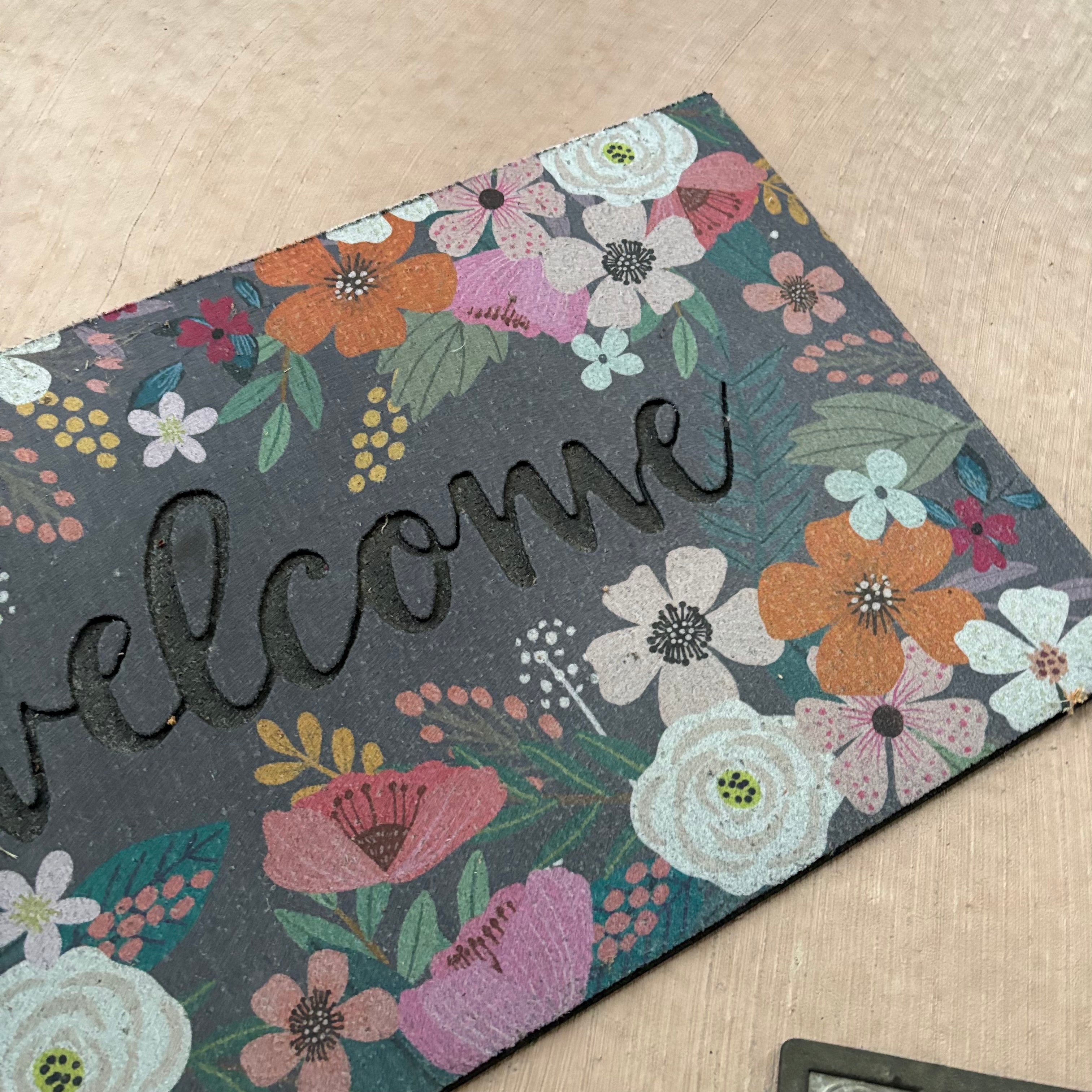 F809 Set of entry rubber mats (two floral and one black)