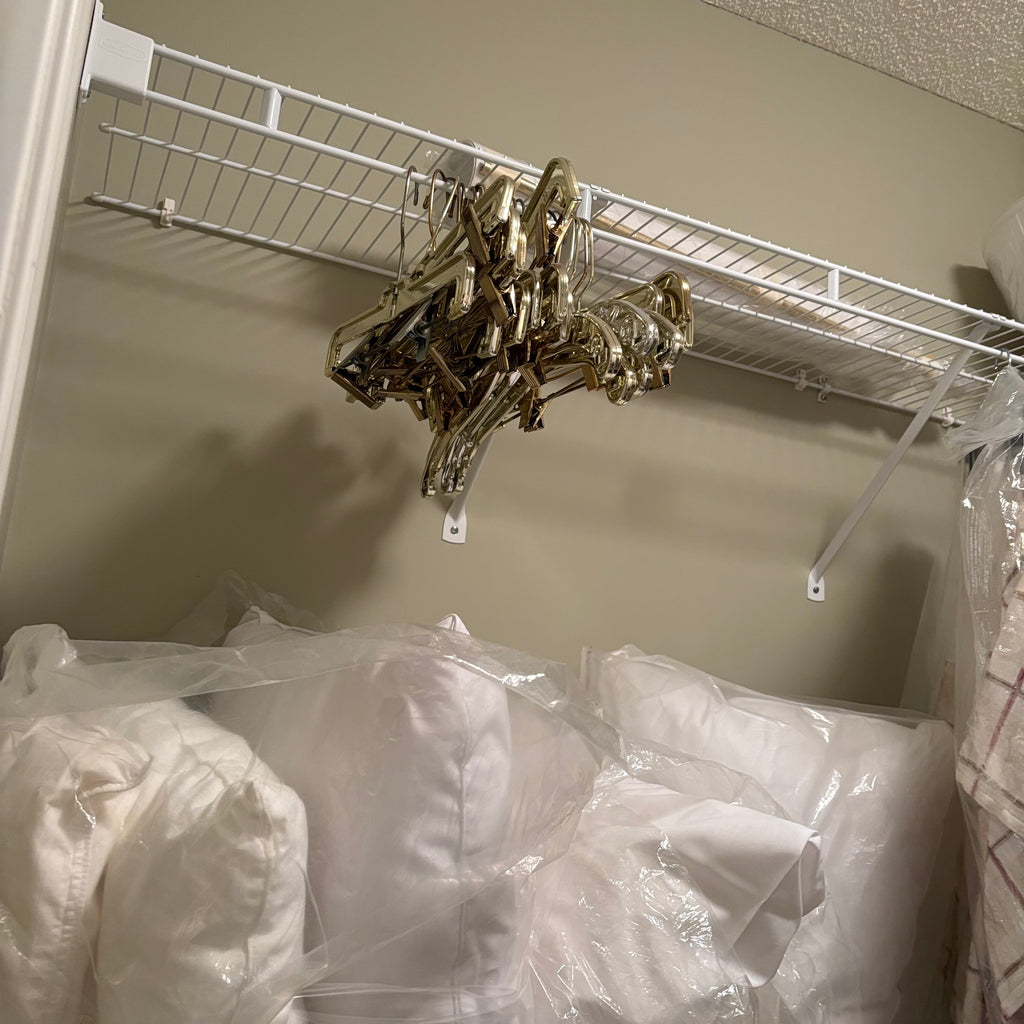 F838 Linen closet contents (gold hangers and more)