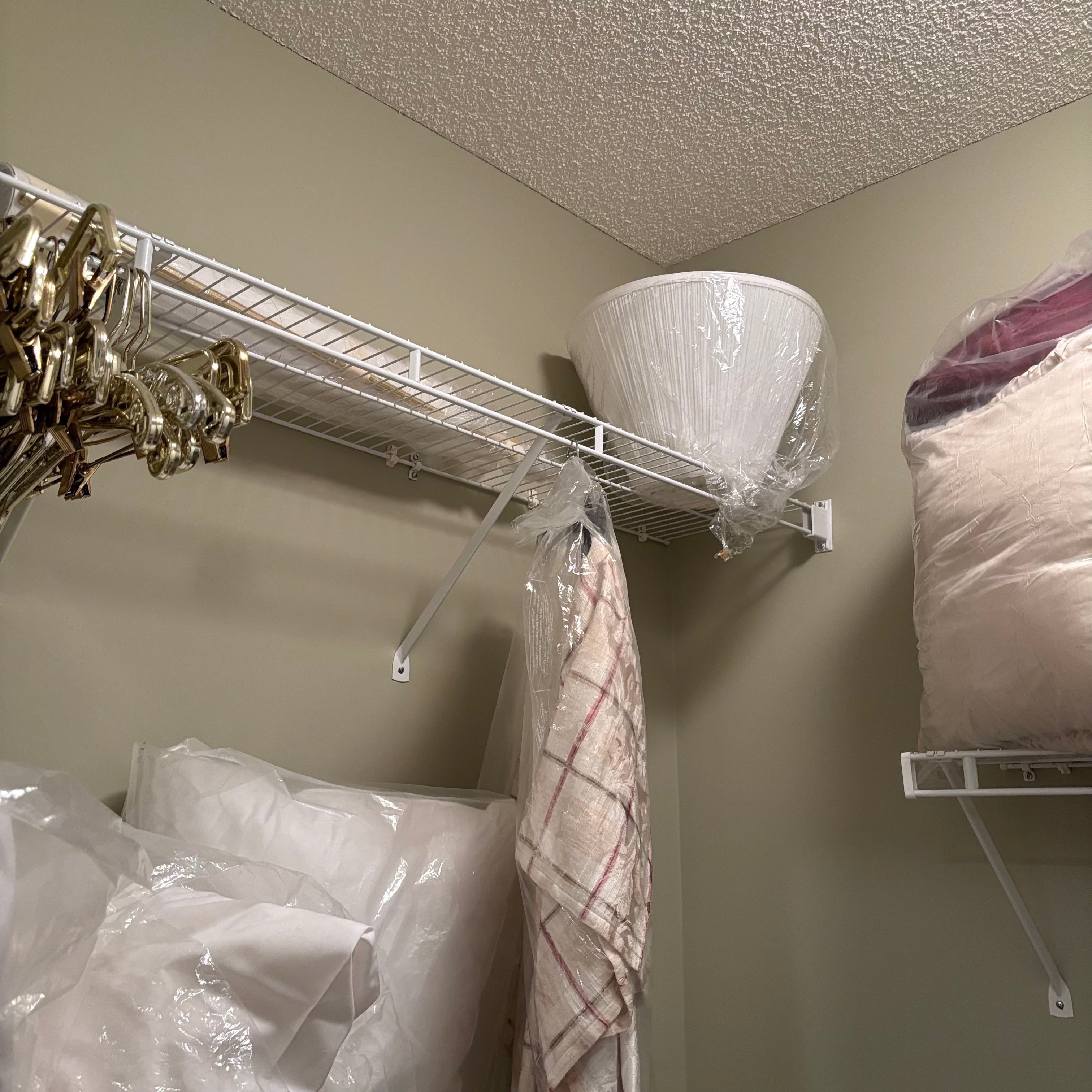 F838 Linen closet contents (gold hangers and more)