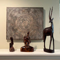 E562 Wall plaque and wooden figurines grouping