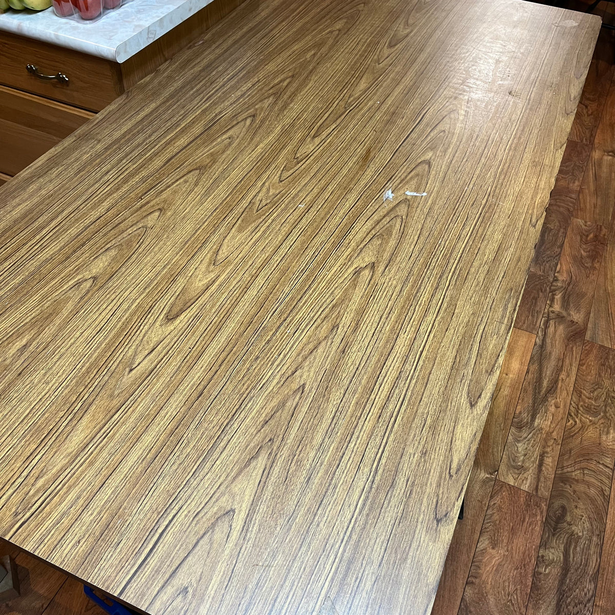 F615 Vintage metal table with wooden veneer top (6ft x 3ft x 29" high, veneer is peeling)