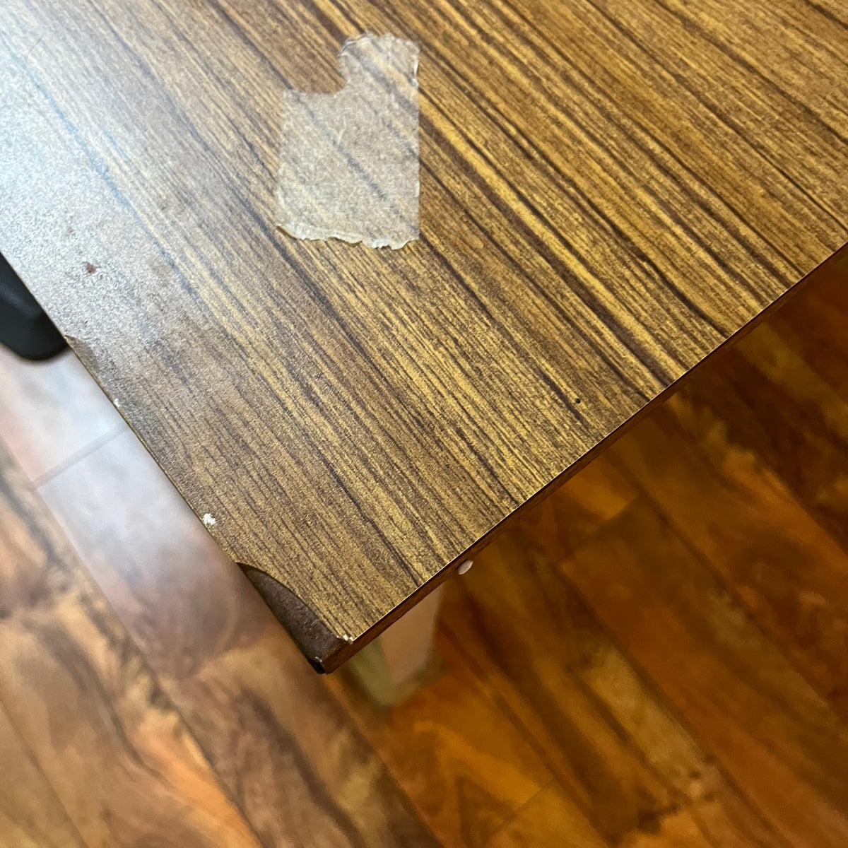 F615 Vintage metal table with wooden veneer top (6ft x 3ft x 29" high, veneer is peeling)
