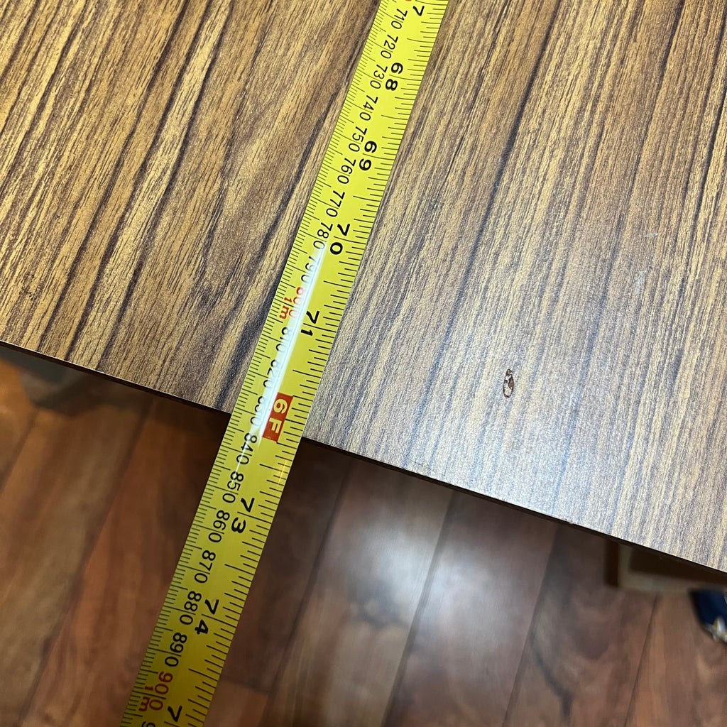 F615 Vintage metal table with wooden veneer top (6ft x 3ft x 29" high, veneer is peeling)