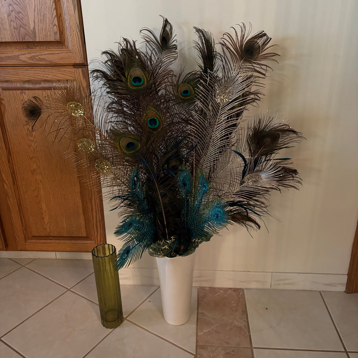 F270 Ceramic vase with peacock feathers