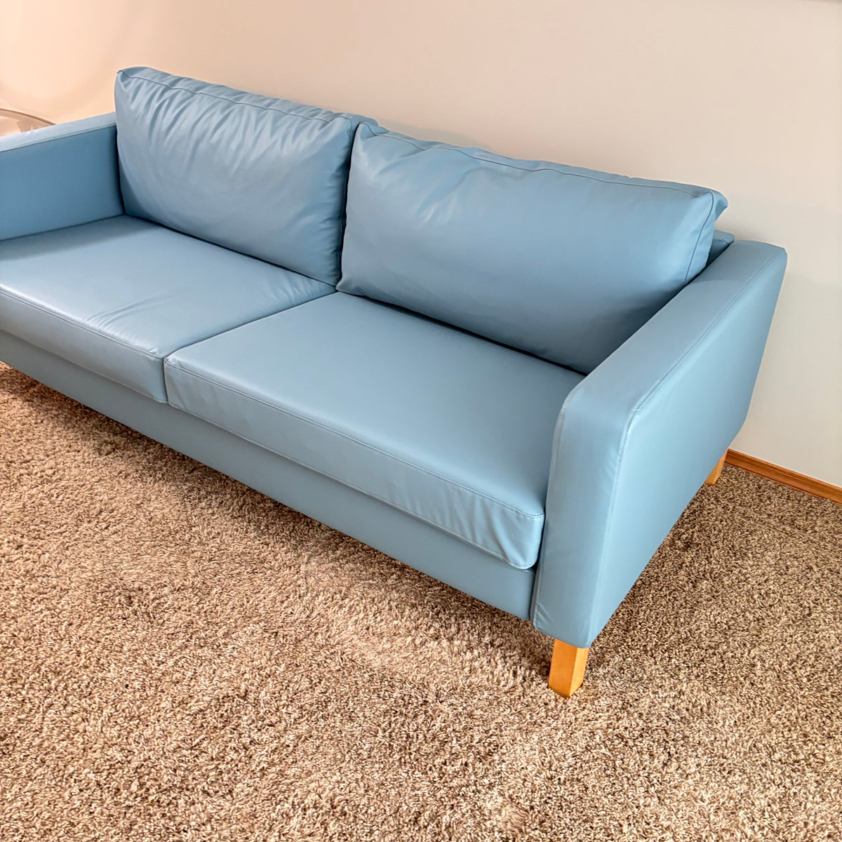 K305 IKEA Parup sofa in light blue faux leather fabric