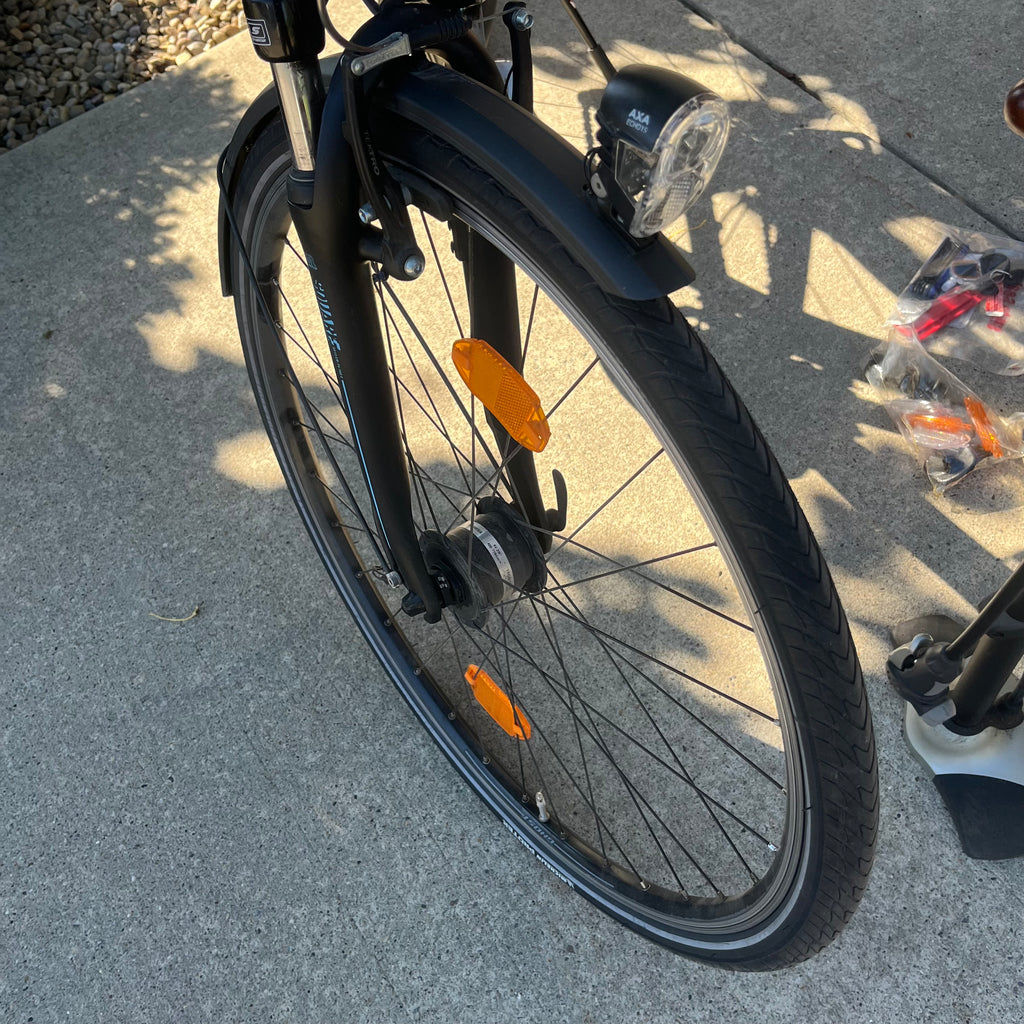 X305 Ghost Square Trekking mountain bike in matte black finish with accessories