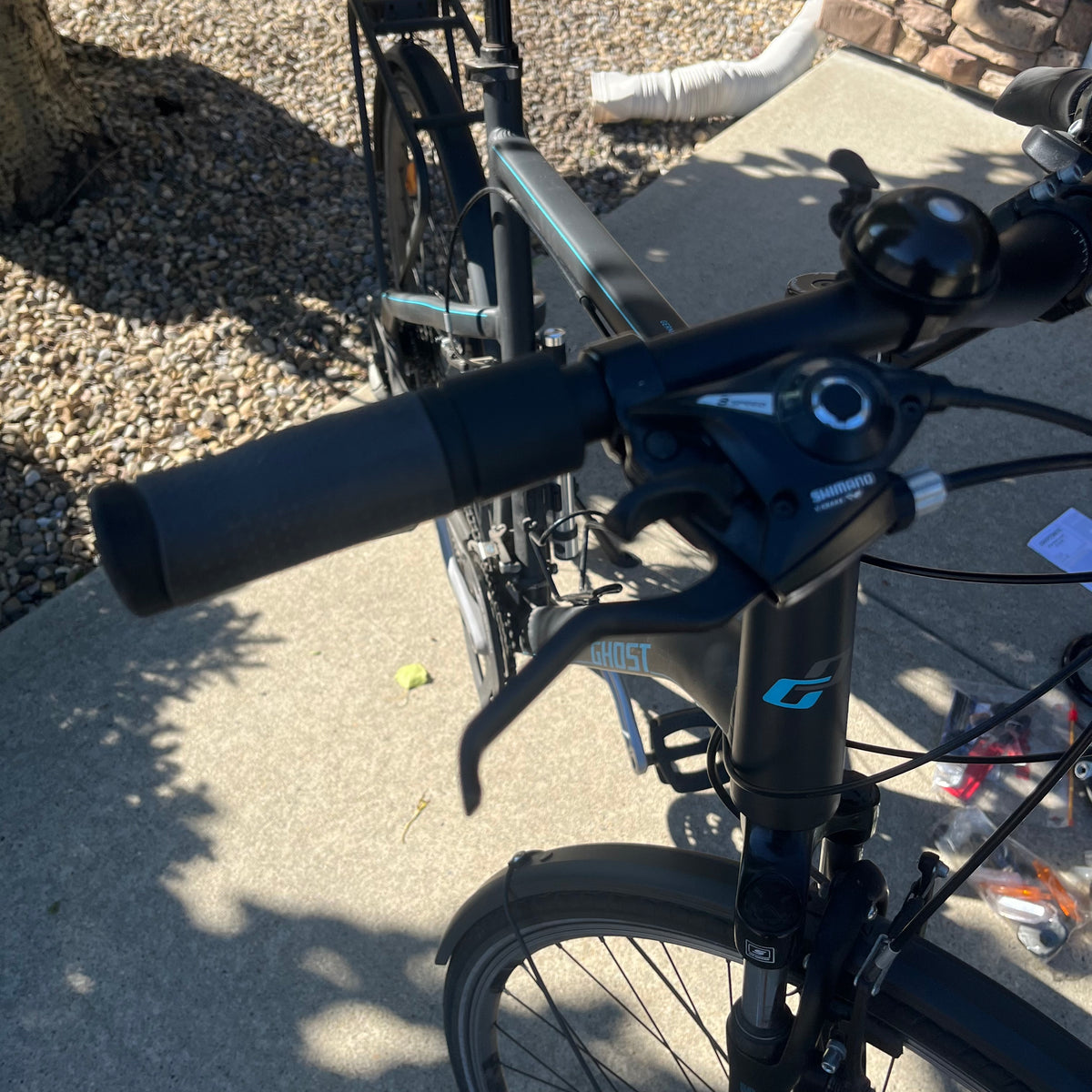 X305 Ghost Square Trekking mountain bike in matte black finish with accessories