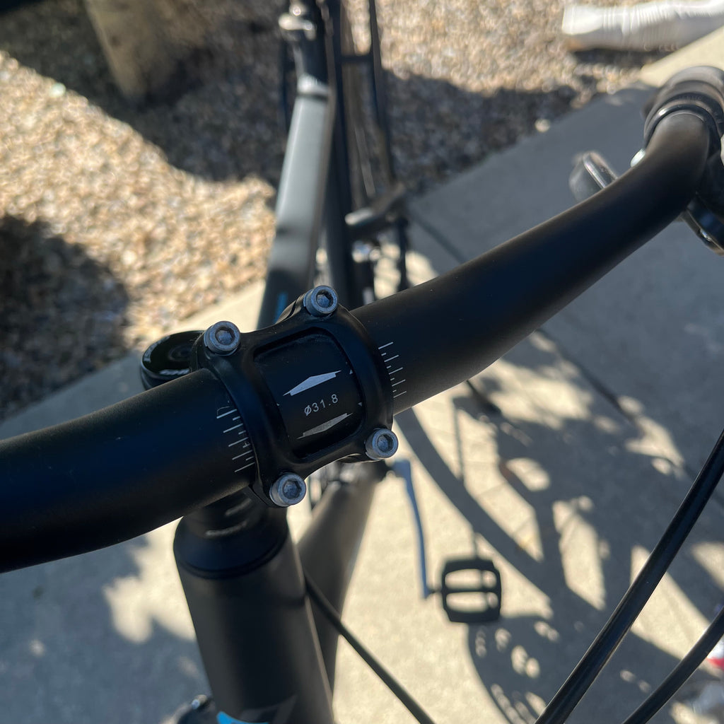 X305 Ghost Square Trekking mountain bike in matte black finish with accessories