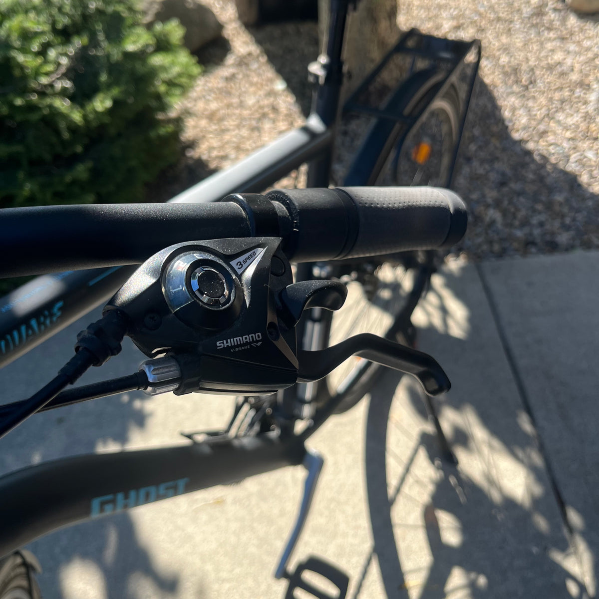 X305 Ghost Square Trekking mountain bike in matte black finish with accessories