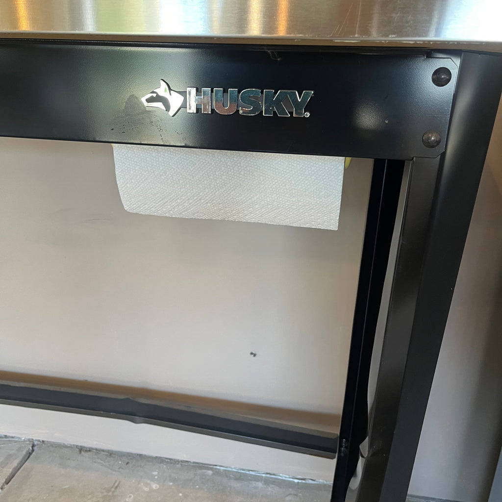 X308 Husky metal worktable (dent in back panel)