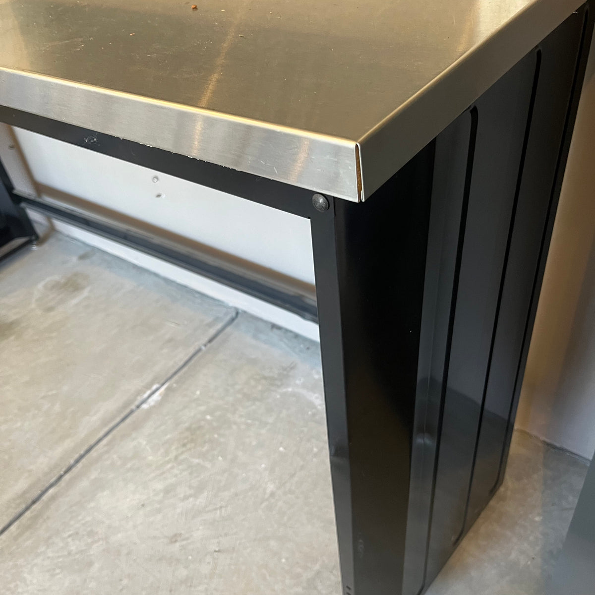 X308 Husky metal worktable (dent in back panel)