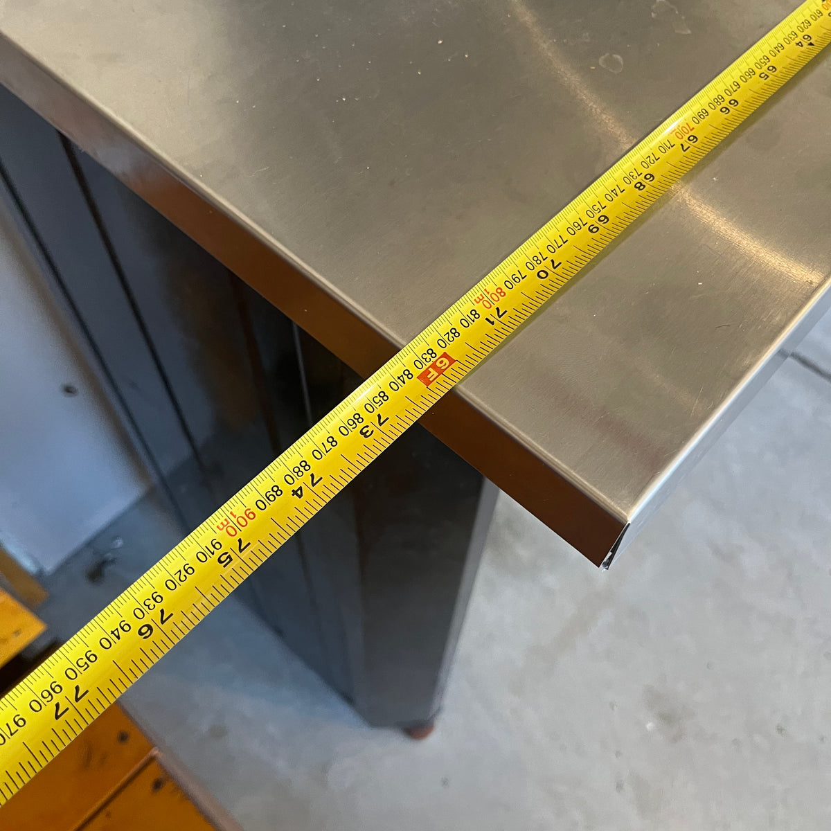 X308 Husky metal worktable (dent in back panel)