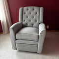 Y100 Grey fabric upholstered reclining/ rocking armchair (rip at far back of seat - visible only when reclined)