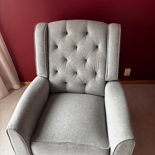 Y100 Grey fabric upholstered reclining/ rocking armchair (rip at far back of seat - visible only when reclined)