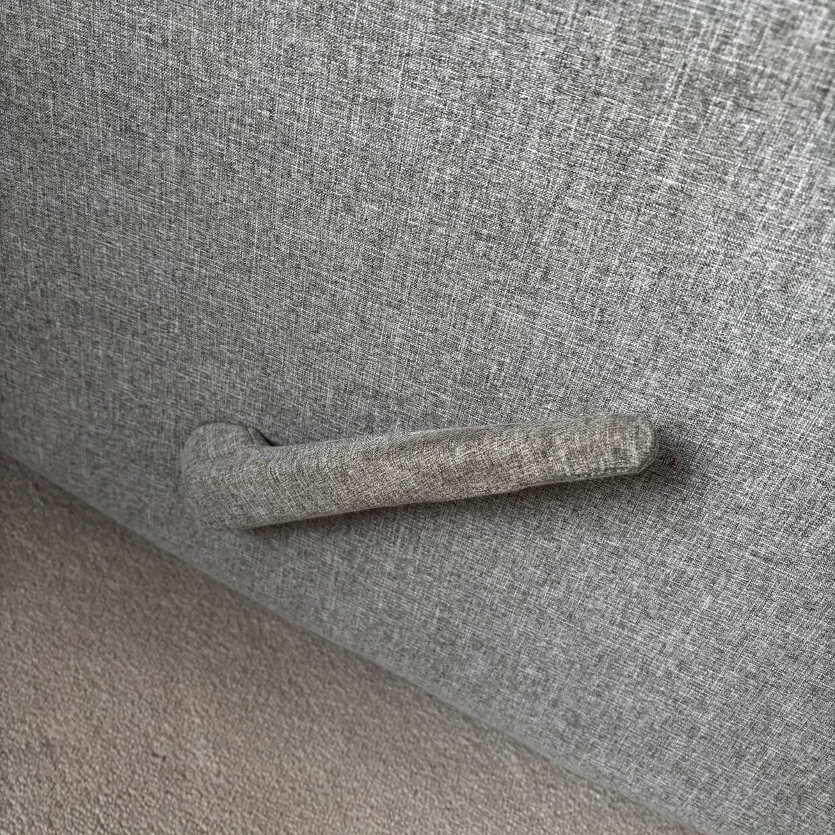 Y100 Grey fabric upholstered reclining/ rocking armchair (rip at far back of seat - visible only when reclined)
