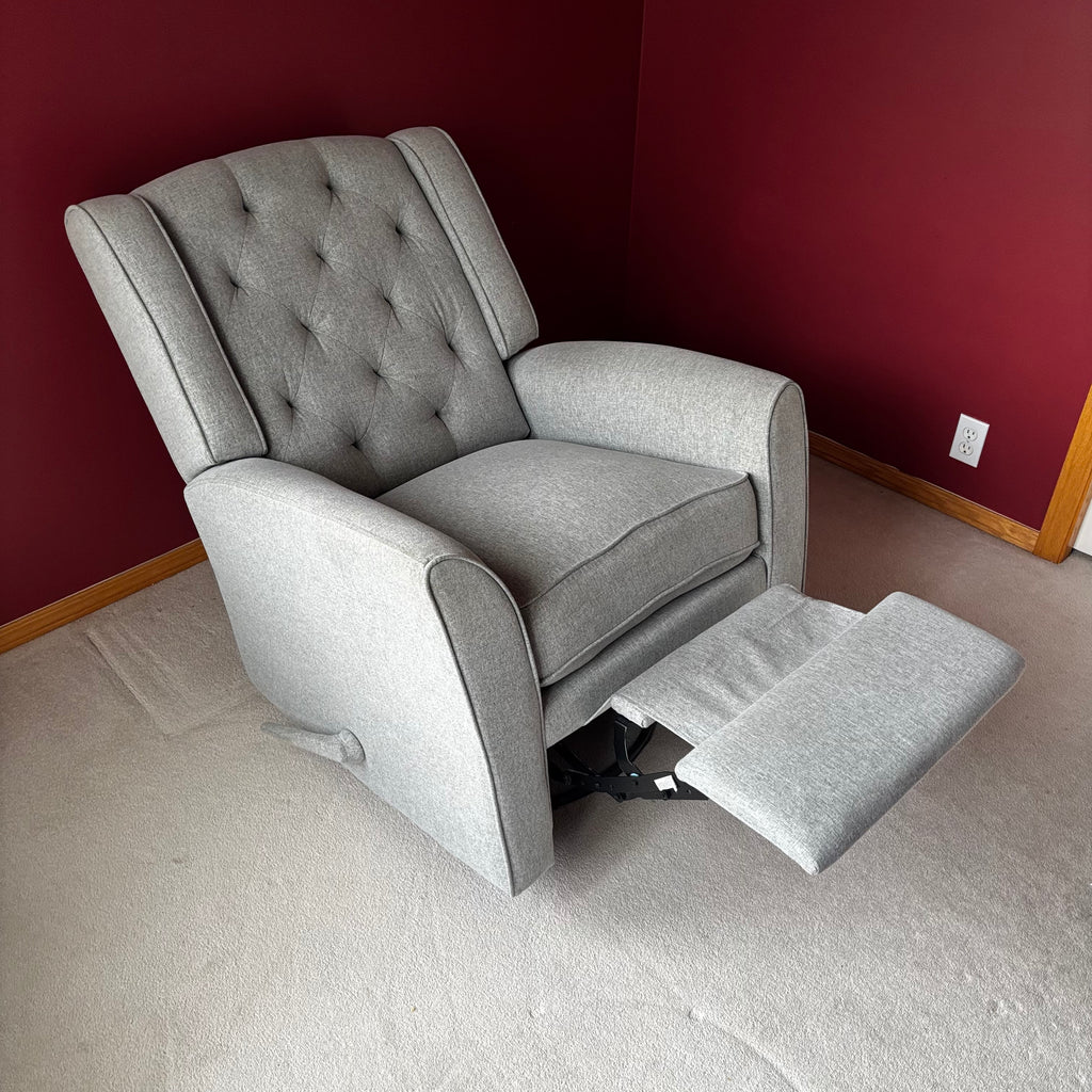 Y100 Grey fabric upholstered reclining/ rocking armchair (rip at far back of seat - visible only when reclined)