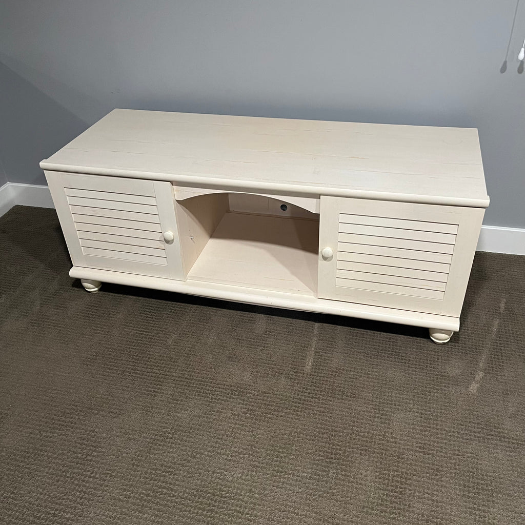 D306 Light colored wooden entertainment centre with storage (wear on top, 60" x 23" x 24")