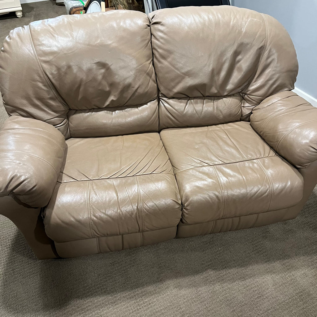 D319 Light beige leather reclining loveseat (wear on leather)