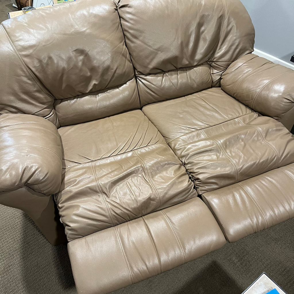 D319 Light beige leather reclining loveseat (wear on leather)