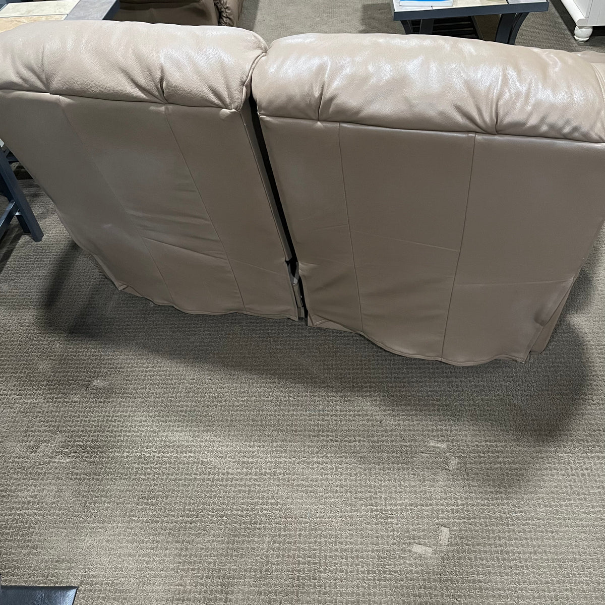 D319 Light beige leather reclining loveseat (wear on leather)