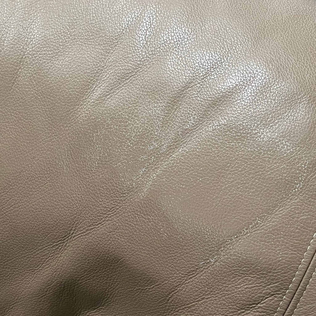 D319 Light beige leather reclining loveseat (wear on leather)