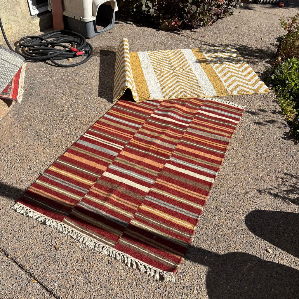 R156 2 Brightly colored striped throw rugs