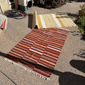 R156 2 Brightly colored striped throw rugs
