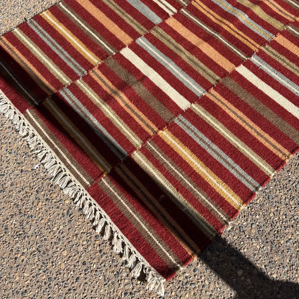 R156 2 Brightly colored striped throw rugs