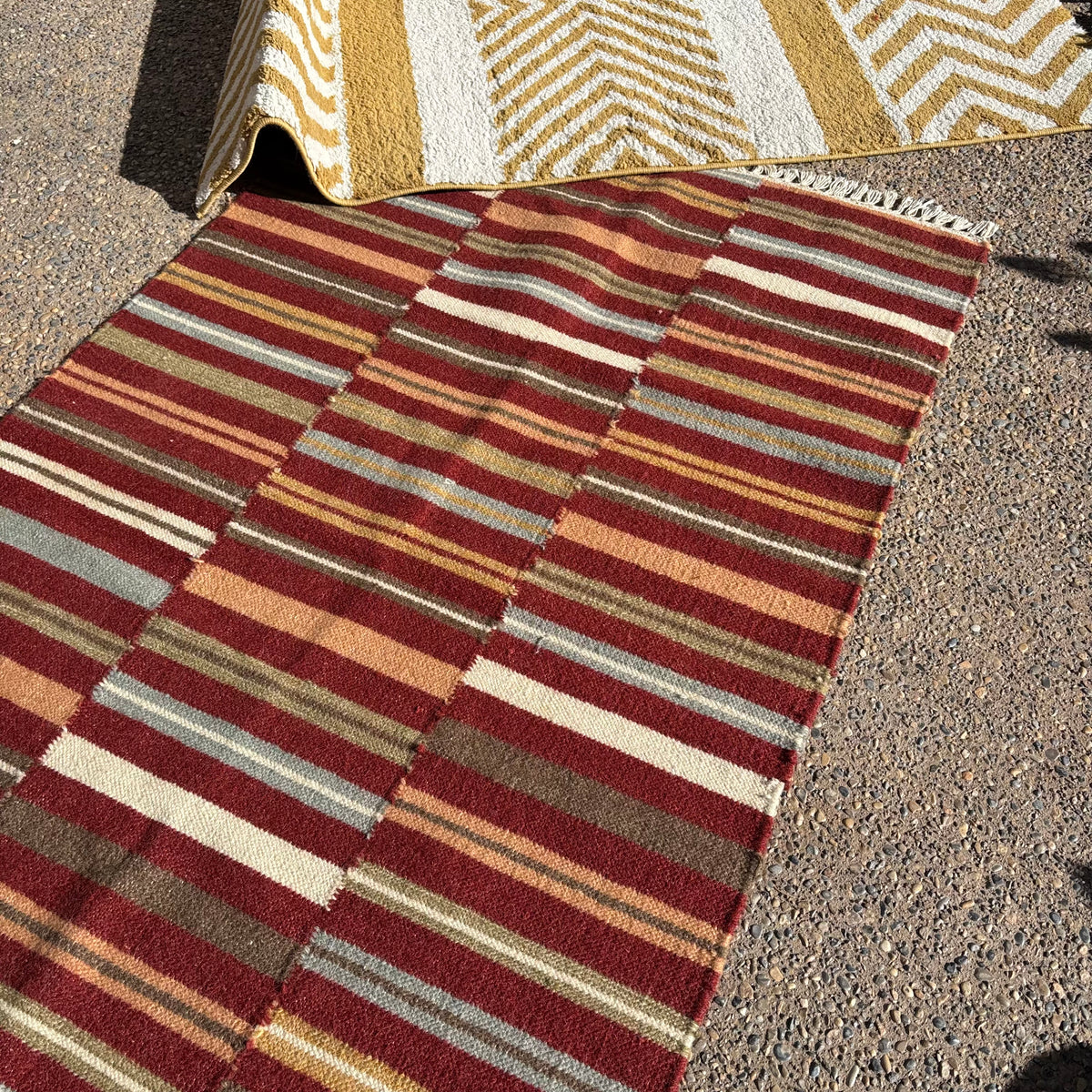 R156 2 Brightly colored striped throw rugs