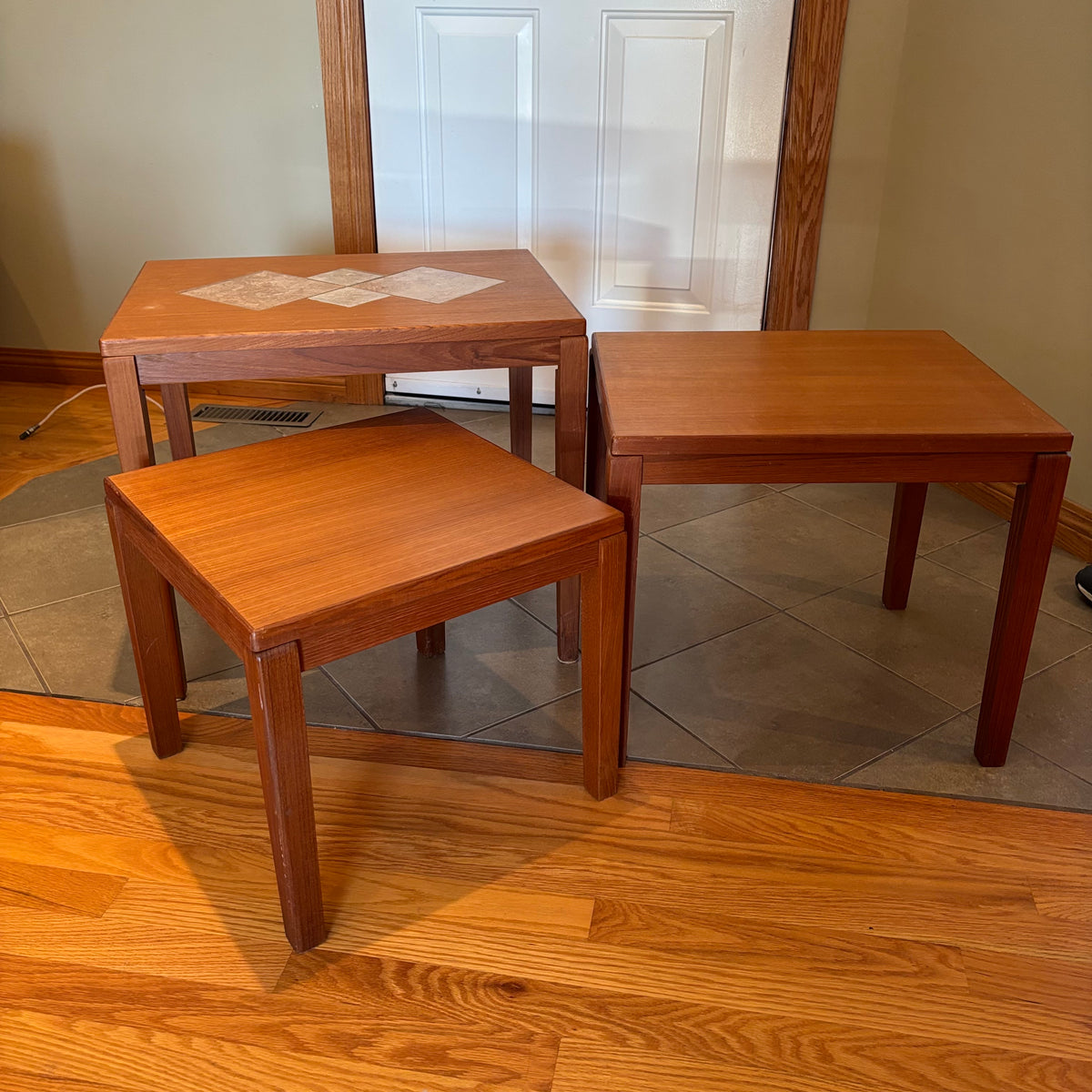 R160 Set of 3 Mid century teak nesting tables (one table has inlaid design)