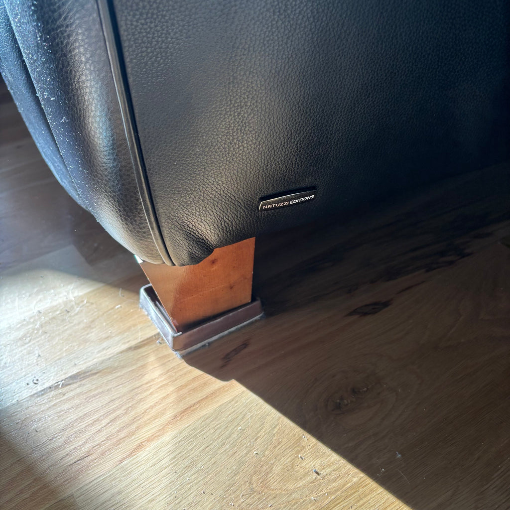 D102 Natuzzi Editions reclining black leather chair (chair has wear)