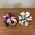 D107 Set of 2 vintage Capodimante ceramic flowers (purple flower has one broken petal)
