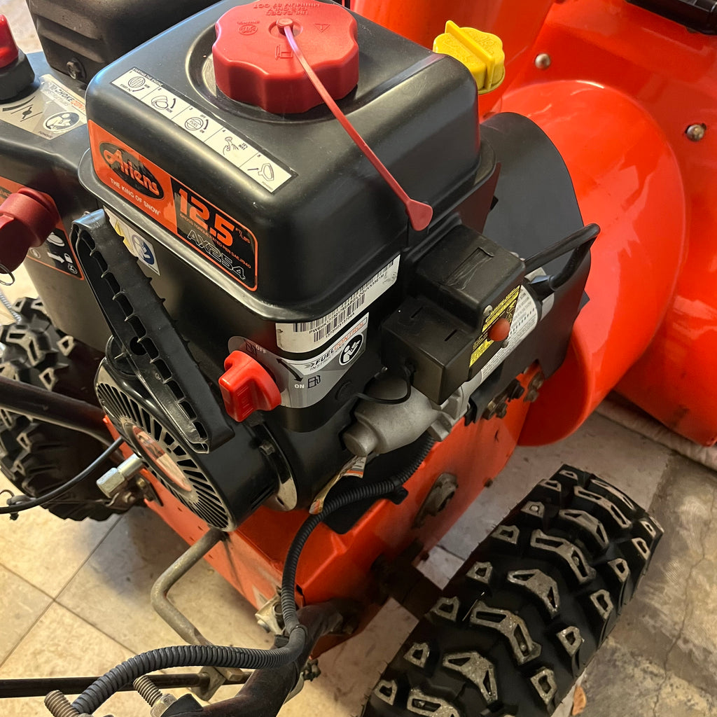 D340 Ariens Sno-Toro Deluxe series, model 811024 snow blower with jerry can