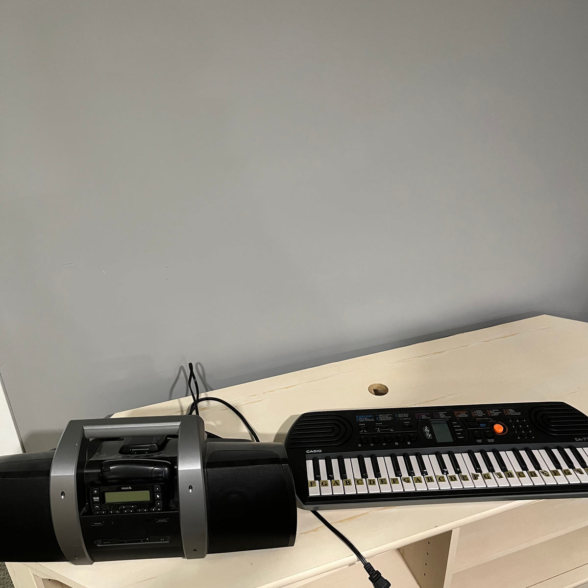 D351 Electronics Grouping( Sirius XM docking station and Casio keyboard)