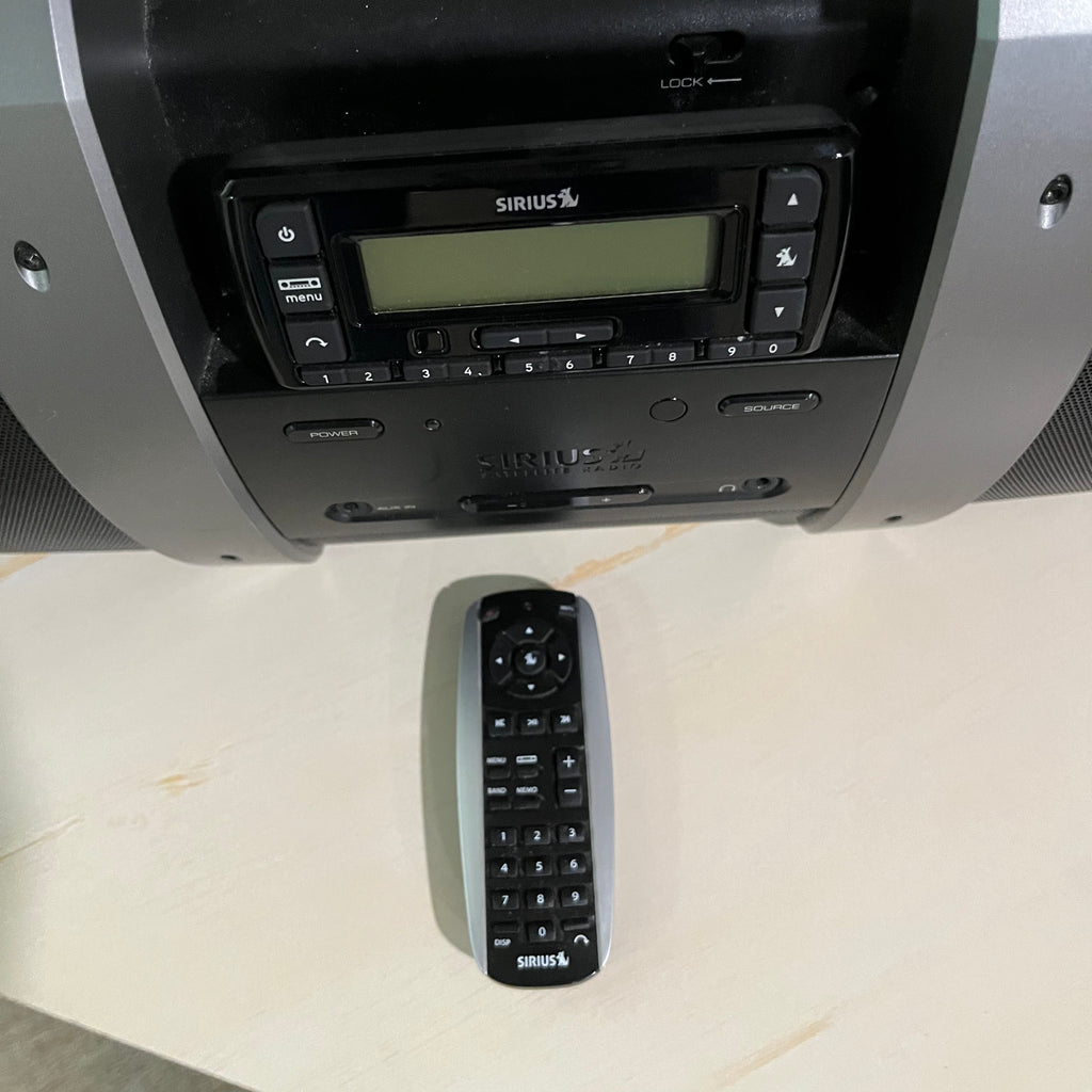D351 Electronics Grouping( Sirius XM docking station and Casio keyboard)