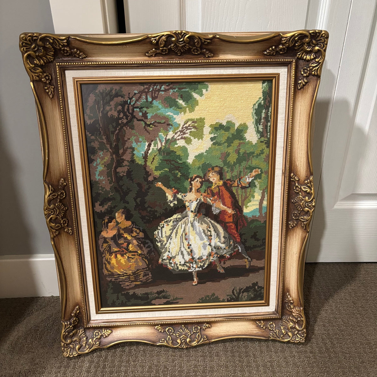 D142 25” x 21” Vintage ornate framed tapestry (couple in a garden)