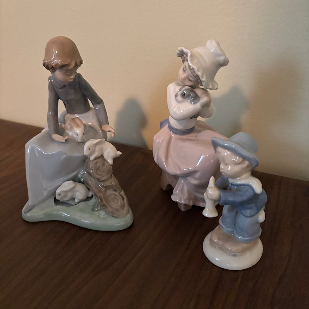 D155 Vintage Lladro and Nao ceramic figurines grouping