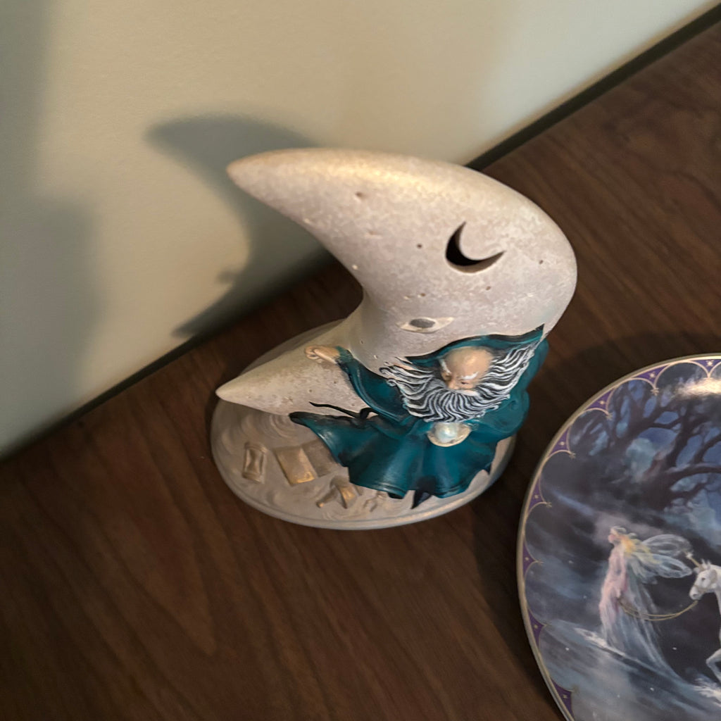 D171 Home Decor Grouping (half moon ceramic figurine and "Trails of Starlight" plate)
