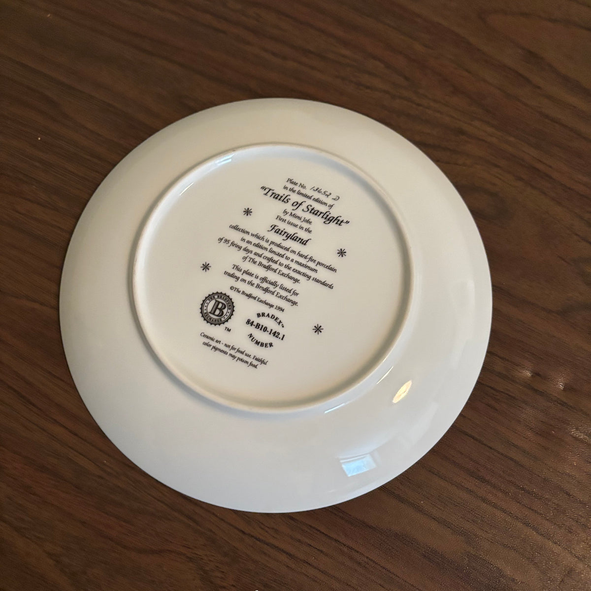 D171 Home Decor Grouping (half moon ceramic figurine and "Trails of Starlight" plate)
